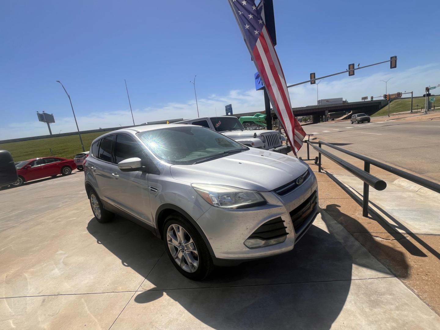 2013 BLACK FORD ESCAPE SEL SEL 4WD (1FMCU9H98DU) with an 2.0L L4 DOHC 16V engine, 6-Speed Automatic transmission, located at 8101 E. Skelly Dr., Tulsa, OK, 74129, (918) 592-3593, 36.121891, -95.888802 - Photo#1